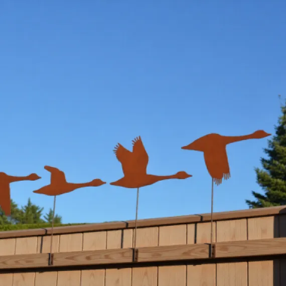 Rustic metal goose fence toppers – handcrafted garden decorations or quirky outdoor gifts for bird lovers