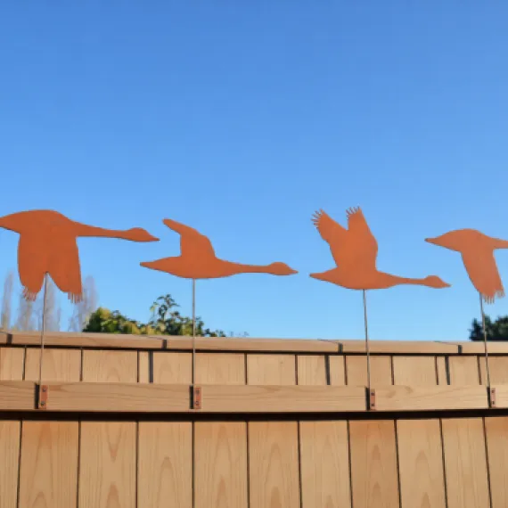 Rustic metal goose fence toppers – handcrafted garden decorations or quirky outdoor gifts for bird lovers